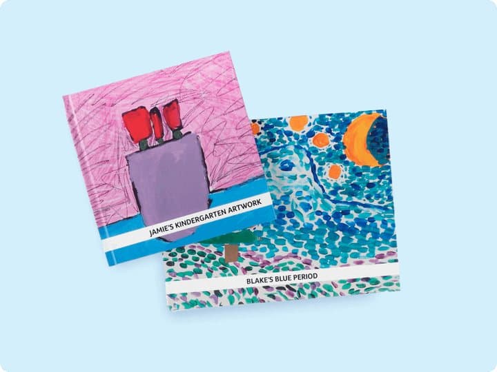 Two Artkive hardcover books titled Jamie's Kindergarten Artwork and Blake's Blue Period