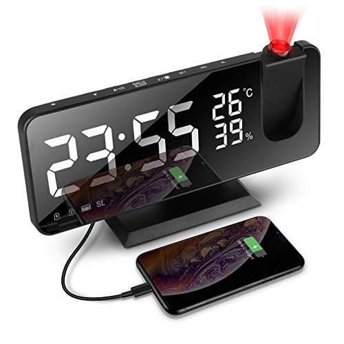 BigTime Pro clock reading 23:55, 26 degrees and 39 percent humidity, with a phone charging from a cable plugged into the clock