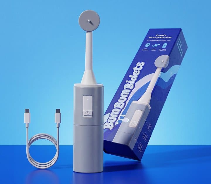 BumBum bidet standing beside its blue retail box and a USB-C charging cable