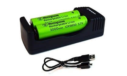 Two green rechargeable 18650 lithium-ion cells in a black charger with a USB cable, offered as the CleanRobot battery pack add-on