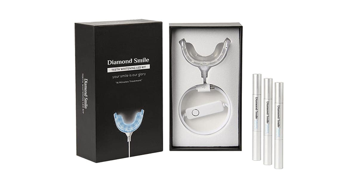 Black DiamondSmile box opened to show a clear LED mouth tray with a cable, beside three white whitening pens