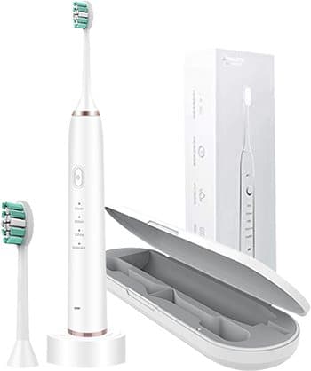 White SonicX PRO sonic toothbrush on a base with a spare head, its box and an open grey travel case