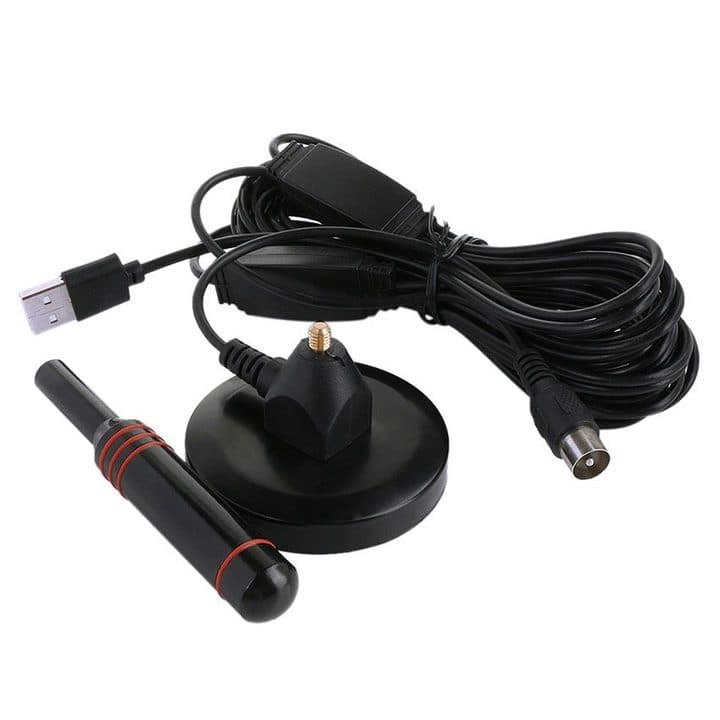 DVB-T UltraBoost parts laid out: the unscrewed black stick antenna, round magnetic base, coiled coax cable with an inline amplifier box, USB lead and IEC plug