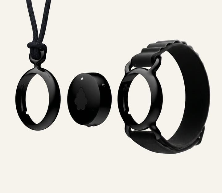 Fieldy pod beside its pendant ring and a black wristband, showing the two ways to wear it