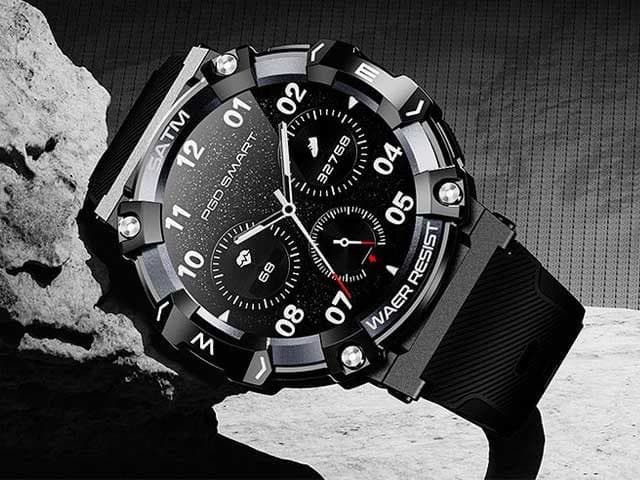 Close-up of the FX SmartWatch on a rock, showing the screwed bezel, compass letters and three sub-dials