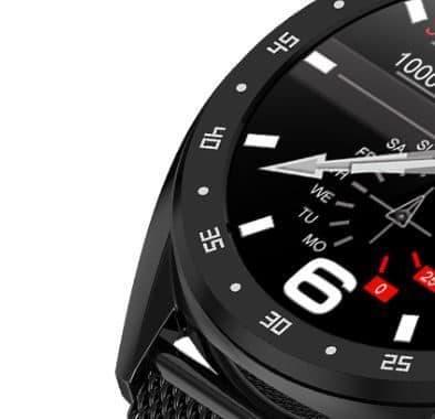 Close-up of a black round smartwatch case with a numbered bezel and mesh strap, used for the GX SmartWatch Allite magnesium chassis add-on