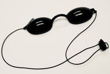 Black protective eye goggles with an elastic strap, sold as the HairRevit Pro eyes protector add-on