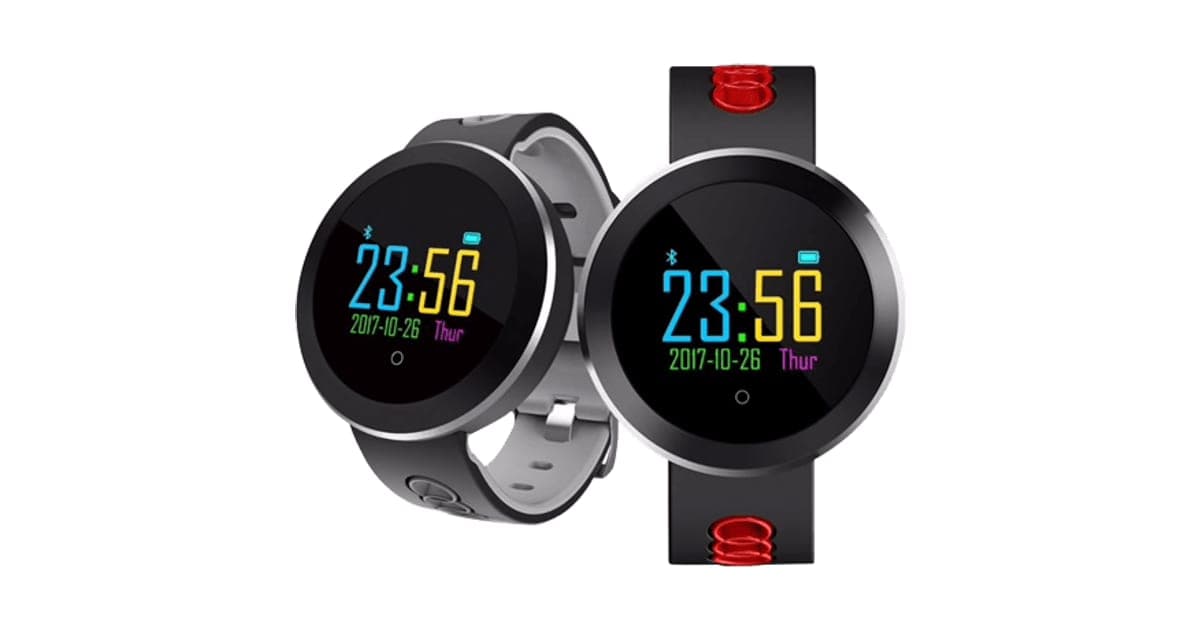 Two round HealthWatch smartwatches with colour screens showing 23:56, one with a grey strap and one with a red and black strap
