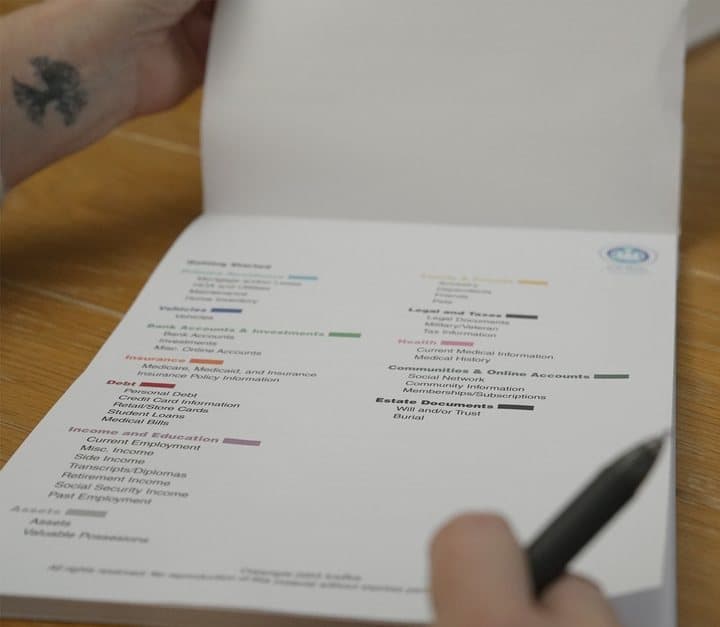 Person ticking items on the ICE Box step-by-step getting started guide with a pen
