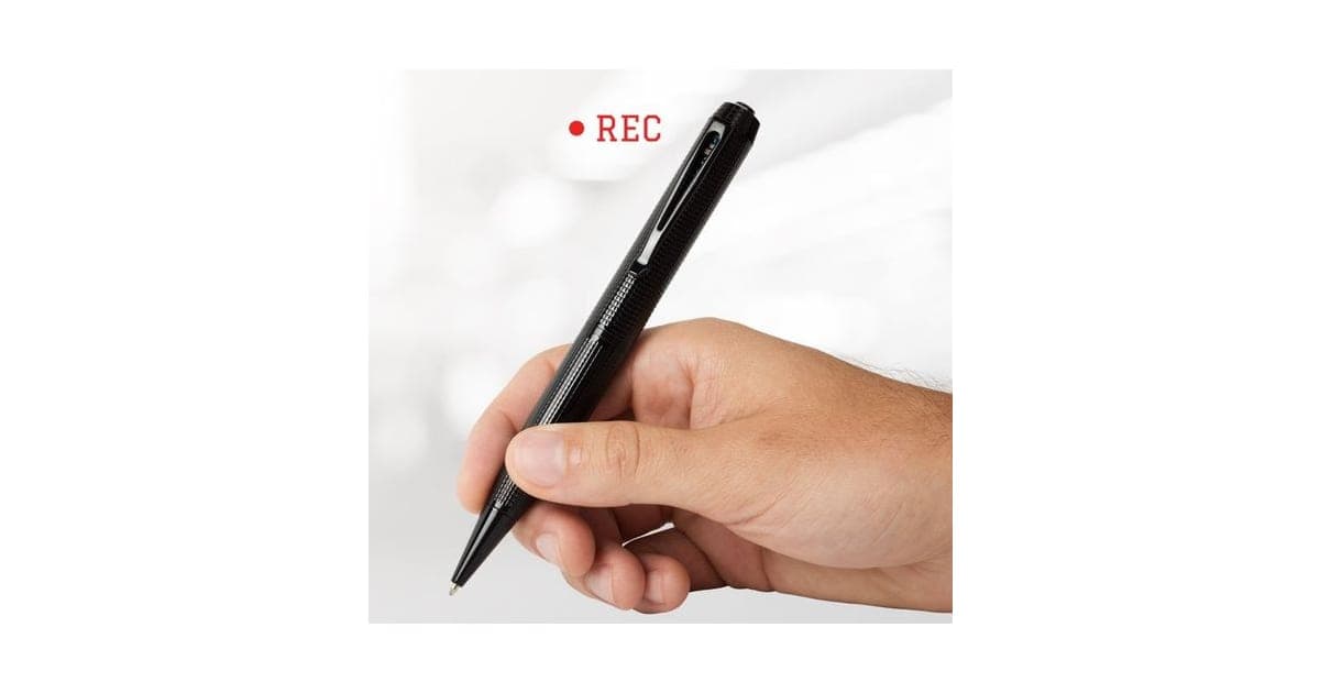 Hand holding the black iSpyPen Pro X camera pen with a textured grip and a red REC label beside it