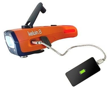 Kelvin 8 with its crank folded out charging a phone through a USB cable