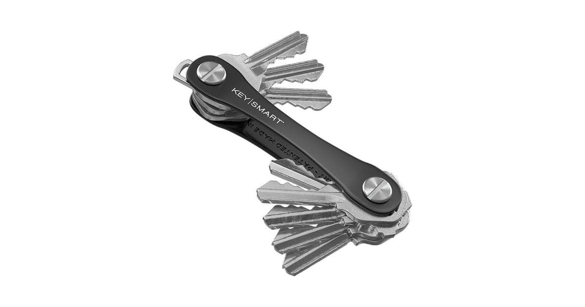 Black KeySmart Original key organizer with several silver keys fanned out from the aluminium frame