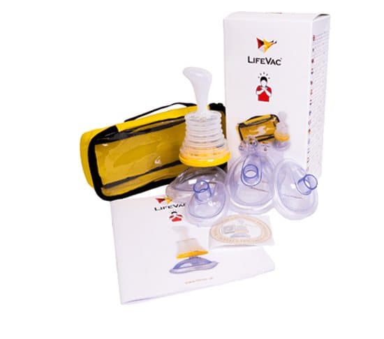 Yellow LifeVac travel bag with the device and masks beside the box