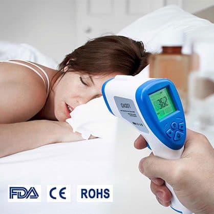 A hand aiming a white and blue thermometer at a sleeping woman's forehead, with FDA, CE and RoHS logos at the bottom, used for the fast scan add-on