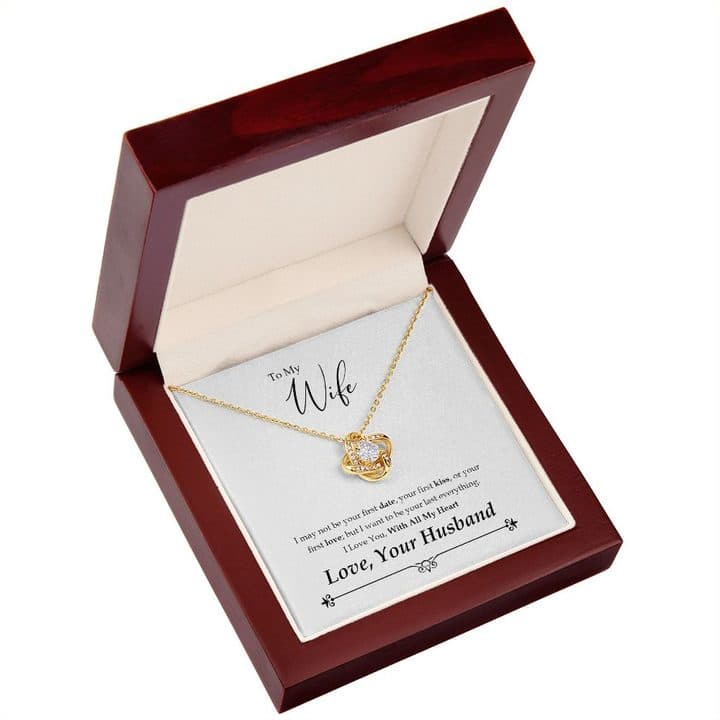 Gold-tone Love Knot Necklace on the To My Wife card in an open red-brown mahogany-style box, seen from above at an angle
