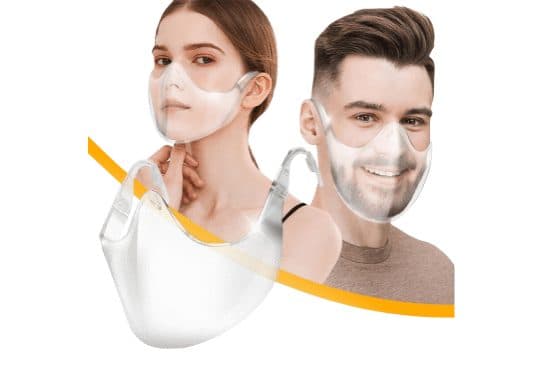 Woman and man wearing clear LucidShield mouth shields that curve under the chin with ear hooks, and a separate clear shield in the foreground