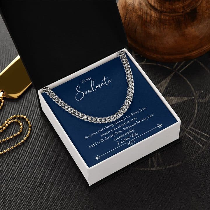 Luxury Cuban Link chain on a navy card reading Forever isn't long enough to show how much you mean to me, in a black box beside a wooden bowl