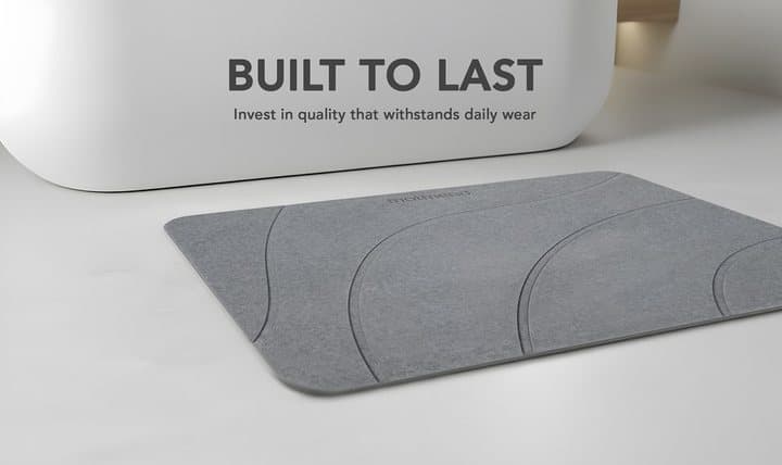MatMend mat on a bathroom floor beside a tub with the words built to last