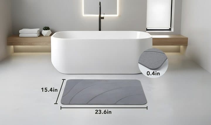 MatMend bath mat beside a bathtub with dimensions of 15.4 by 23.6 inches and 0.4 inches thick