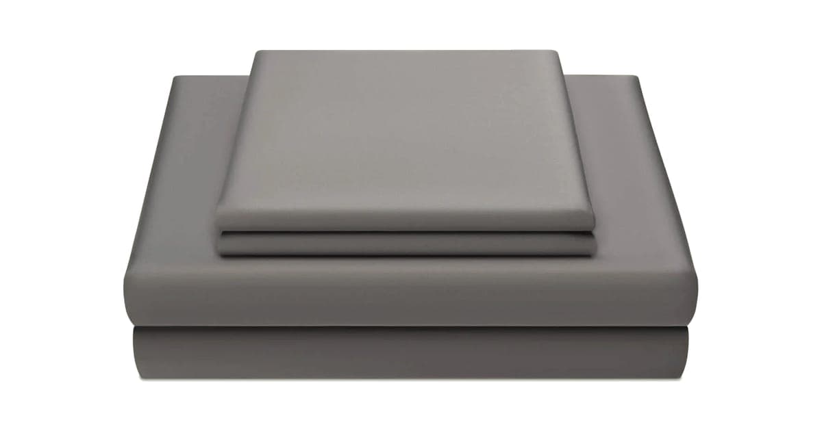 Miracle Made sheet set in Stone grey, folded flat sheet, fitted sheet and pillowcases stacked on a white background