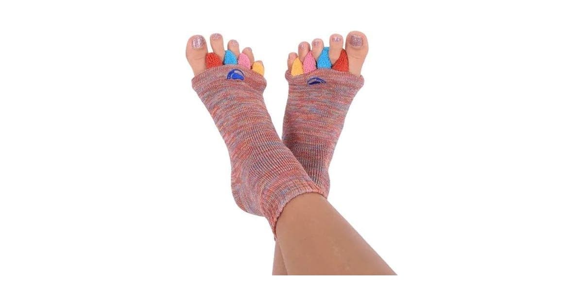 Pair of feet wearing multicoloured My Happy Feet toe alignment socks with spacers between the toes