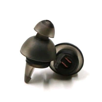 Two smoky grey flanged NoiseBudsX earplugs with the filter insert visible at the base of one