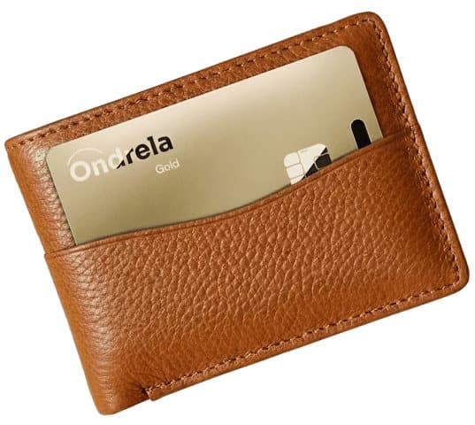 Ondrela gold tracker card tucked into the pocket of a tan leather wallet