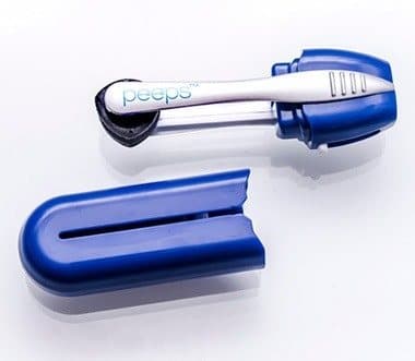 Blue Peeps cleaner with the tongs removed from the case to show the carbon pads