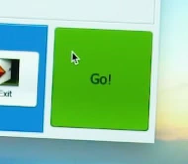 ThePhotoStick program window with a large green Go button and a mouse pointer