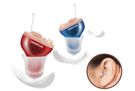 Red and blue PicoBuds Pro devices with skin-coloured faceplates, volume wheels, clear bell tips and thin pull strings, beside an ear wearing one
