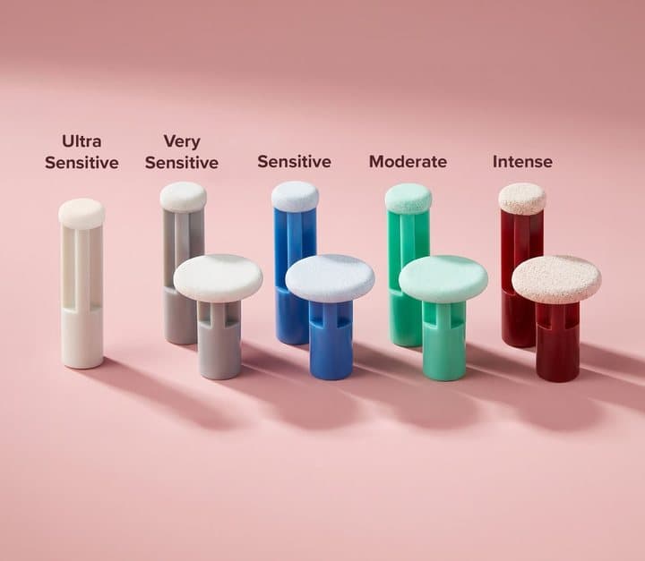 Five PMD exfoliating discs in different colours labelled ultra sensitive to intense