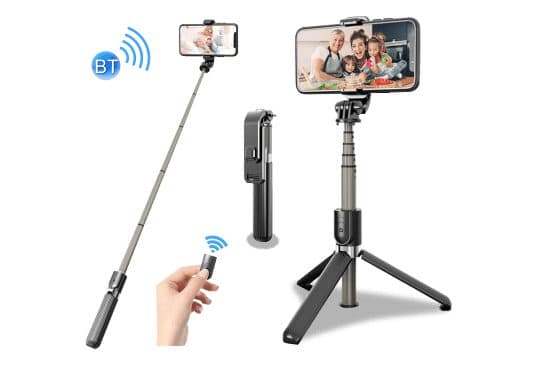 Black telescopic selfie stick extended with a phone, the folded stick, the stick standing on three tripod legs with a phone showing a family, and a hand holding a small Bluetooth remote