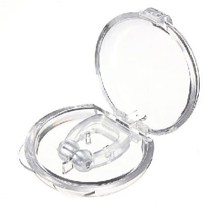 Clear round plastic travel case opened to show a SilentSnore silicone nose clip inside