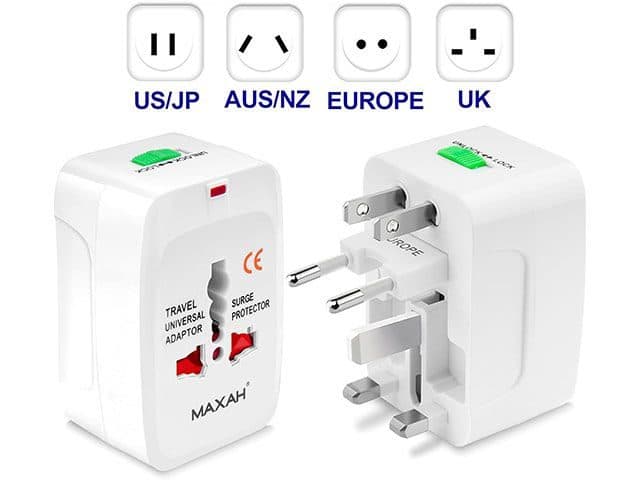 White Maxah universal travel plug adapter with US, Australian, European and UK pins and a surge protector label