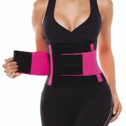 Woman fastening a black and pink neoprene SlimShaper belt with hook-and-loop strips around her waist