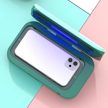 Teal UV sanitiser box seen from above with a lilac smartphone lying inside and a blue UV light in the open lid, used for the XL size add-on