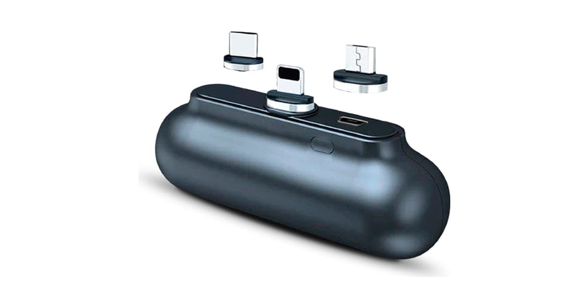 Small dark grey Snap-N-Charge power bank with three magnetic tips, Lightning, USB-C and Micro-USB, floating above it