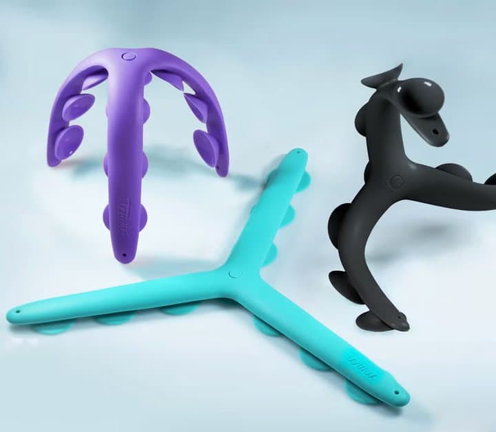 Purple, teal and black Tenikle mounts shown side by side