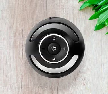 Top of a TikiTunes speaker showing power, volume, light and play buttons