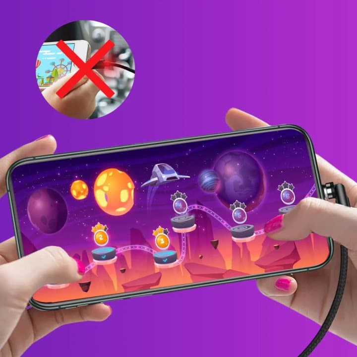 Hands holding a phone sideways playing a game while connected to a Whippy Charge cable